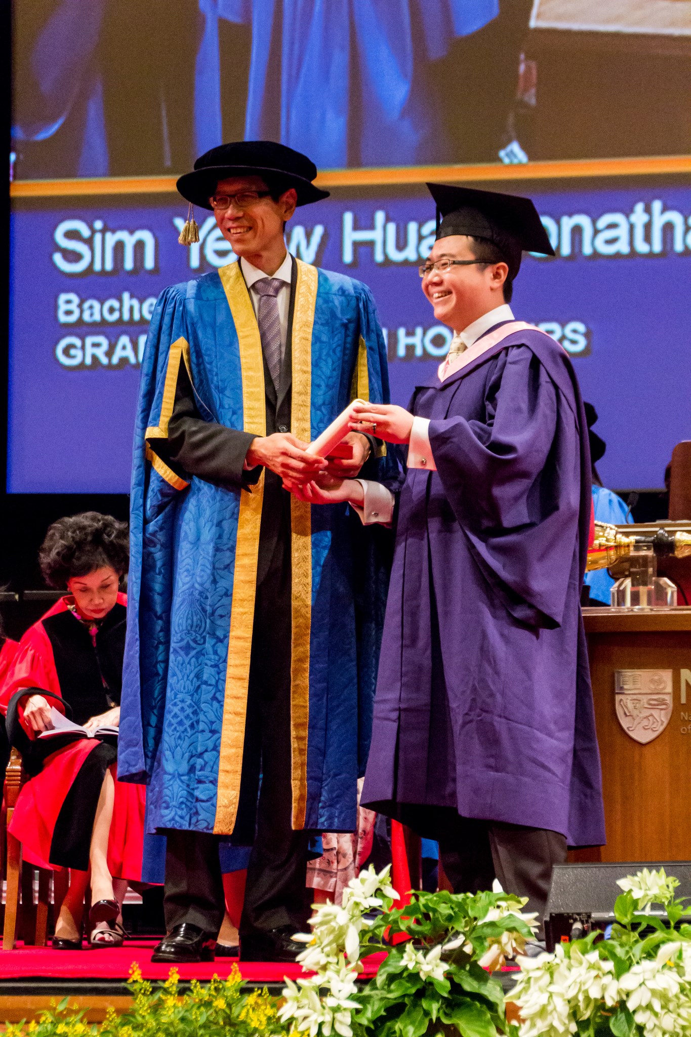 Notice the Chinese calligraphy necktie?